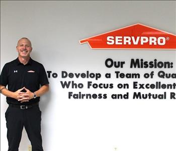 man in front of mission statement